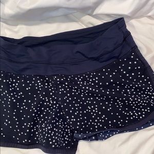 Lululemon tracker shorts. Navy and white.